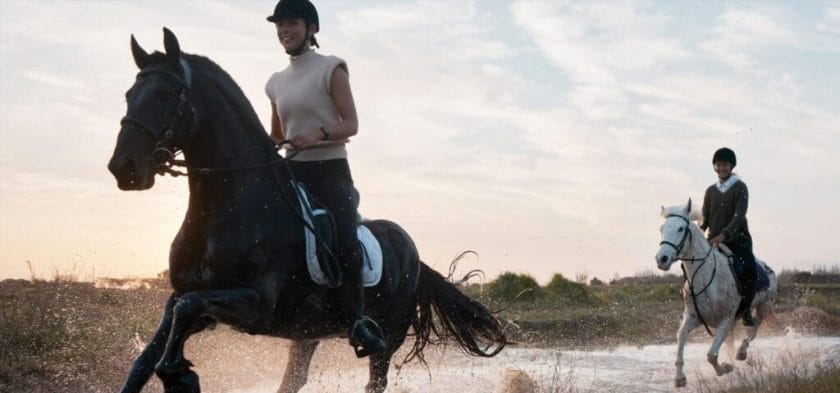 Shot of two young women out horseback riding together