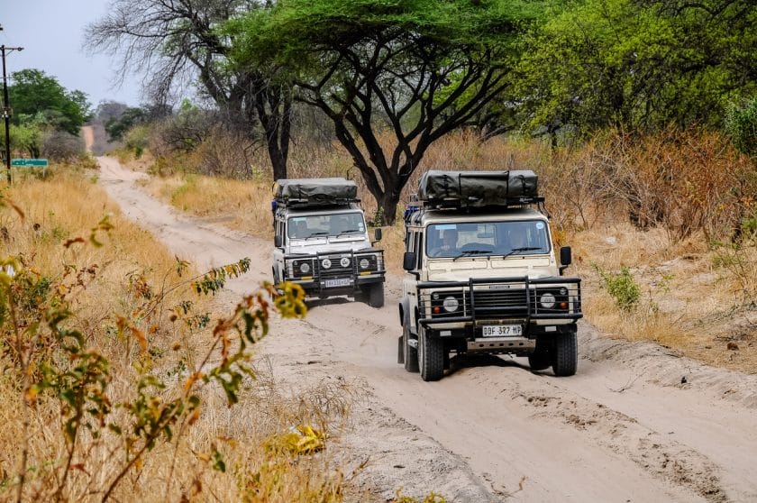 Off-road vehicles on a sandy track in Botswana