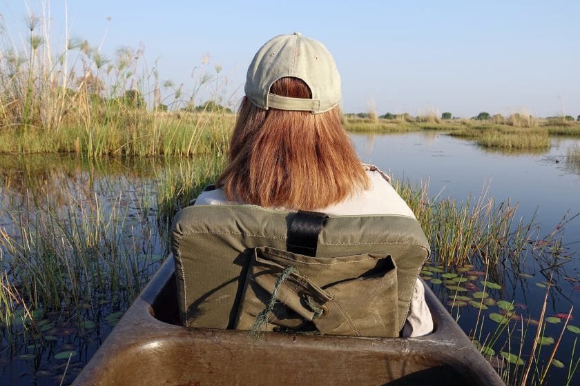 Woman on a mokoro safari, Botswana.