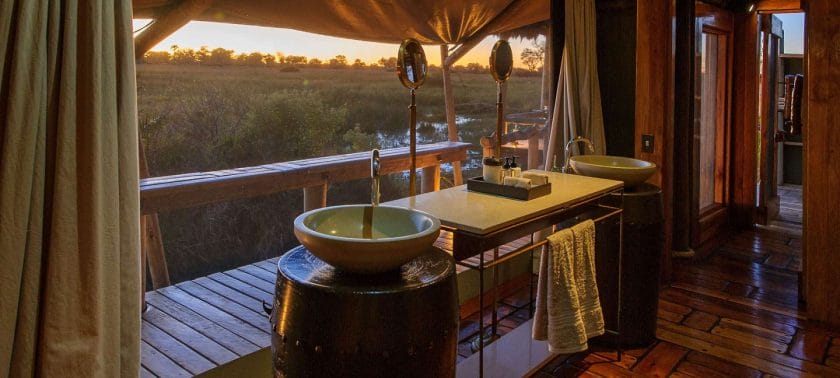 Bathroom in a luxury suite at Wilderness Mombo Camp | Photo credits: Wilderness Mombo Camp