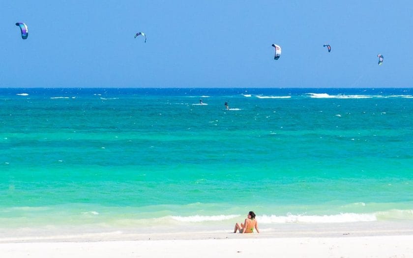 Tourist relaxing on Diani beach in Kenya.