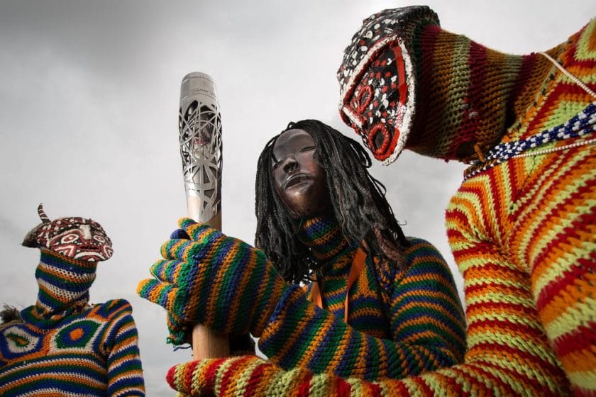 Makishi dancers perform for crowds in giant, painted masks and flamboyant headdresses, credit: Flickr