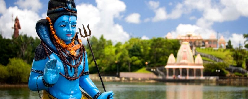Grand Bassin is surrounded by candy-coloured statues of gods and Hindu temples Credit: Easyvoyage