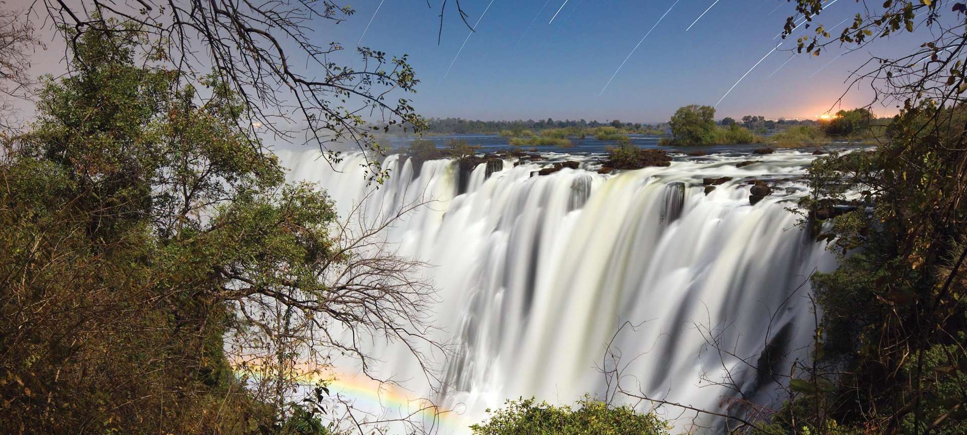 The Top 11 Best Victoria Falls Safari Lodges Discover Africa   10 1 Environment Victoria Falls With Lunar Rainbow   1920x864 1 