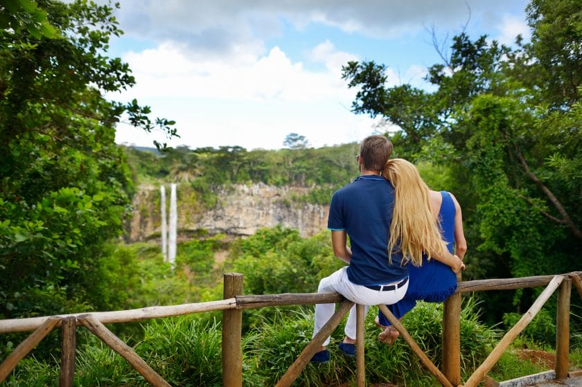 Young couple enjoying perfect view on Chamarel falls of Mauritius