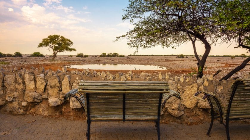 Bench at the waterhole of Okaukuejo Campsite, Namibia.
