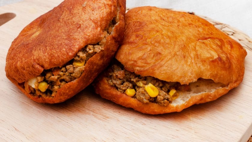Vetkoeks filled with a ground beef mixture.