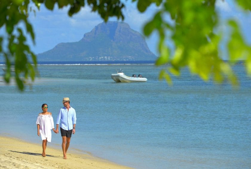 A couple walking on the beach | Photo credit: Sofitel Mauritius L'Impérial Resort & Spa