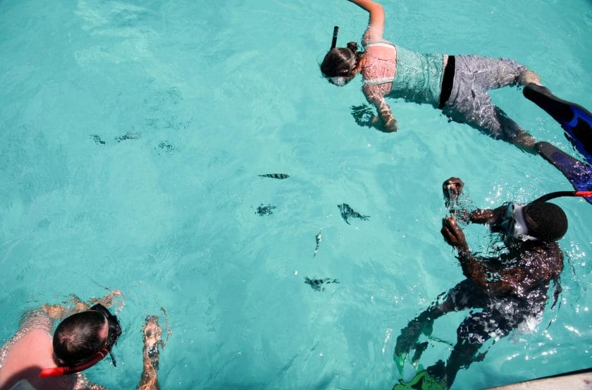 Tourists snorkeling in the Mnembe Atoll, Zanzibar.