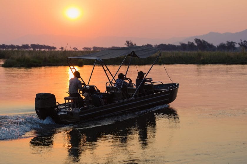 A private boat cruise at sunset on the river